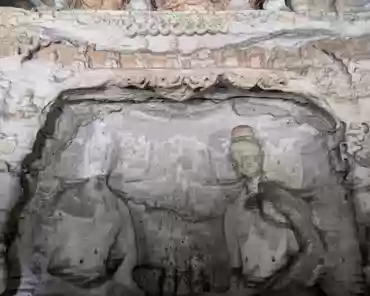 PXL_20241025_025110889 The right cave has a front and back chambers. The main chamber is horizontal rectangular shape. The sculptures in the cave show the mixed style of both Han...