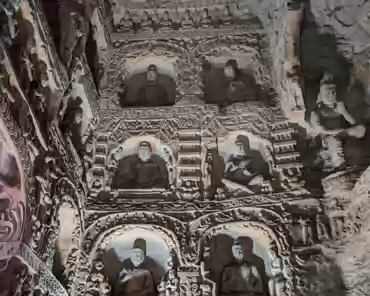 PXL_20241025_025209109 The right cave has a front and back chambers. The main chamber is horizontal rectangular shape. The sculptures in the cave show the mixed style of both Han...