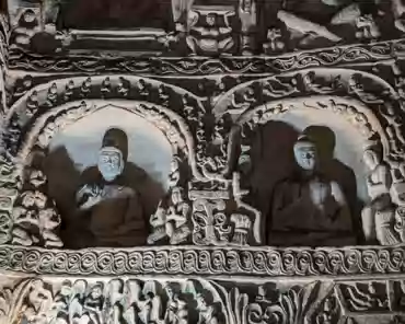 PXL_20241025_025219247 The right cave has a front and back chambers. The main chamber is horizontal rectangular shape. The sculptures in the cave show the mixed style of both Han...