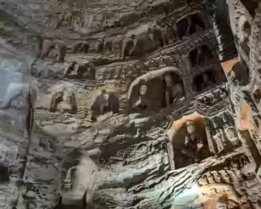 PXL_20241025_024531125 Cave of the Great Buddha. Outside Wooden structures: 1651. Two luxuriant holy trees are carved on the sides of the entrance and two Buddhas seat under the...