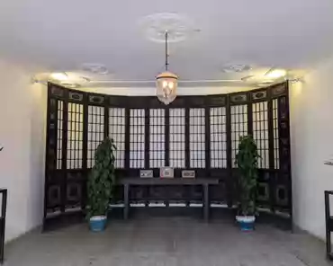 PXL_20241109_060040451 Back hall, folding screen with 12 screen doors.