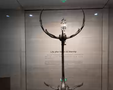 PXL_20241110_073233578 Bronze standing crane with deer antlers.