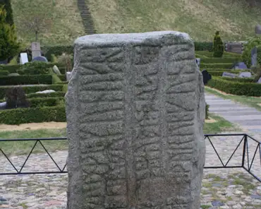 06 The oldest is the smallest stone, erected by king Gorm in memory of his wife Thyra. The text says 