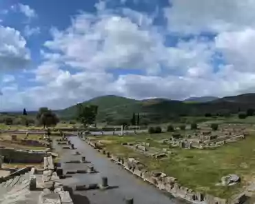 PXL_20240418_074405207.PANO Sanctuary of Asclepios. 140 bases for bronze honorary statues of eminent citizens. The courtyard is surrounded by 4 double stoas. There are rooms and buildings...